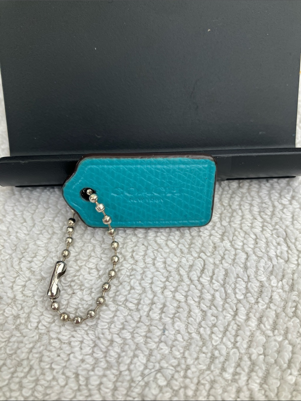 Coach Small 1” bright torquoise blue pebbled leather hang tag